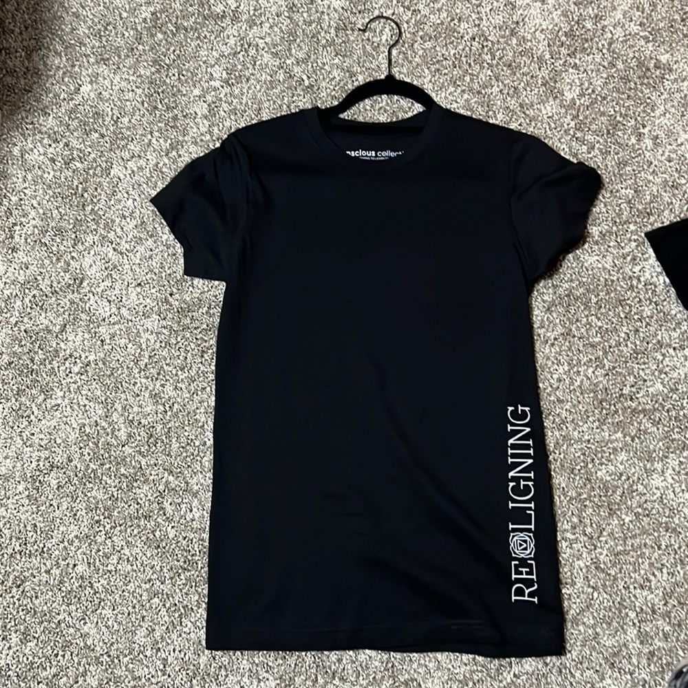 Black “realigning” tshirt
